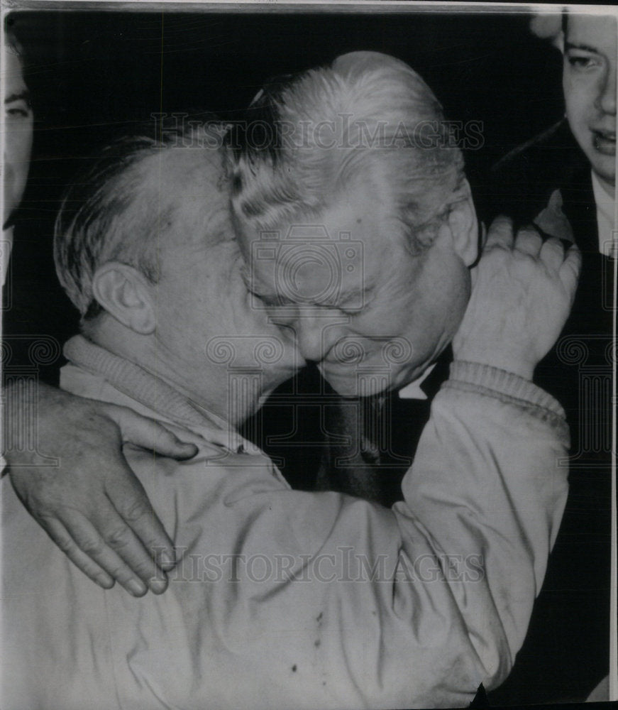 1965 Man hugs President David J. McDonald - Historic Images