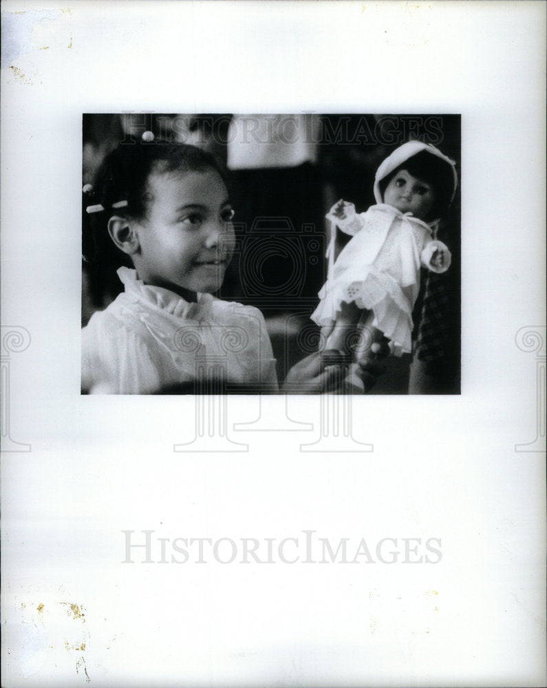 Press Photo Taken By David Babcock of a Girl and Doll - Historic Images