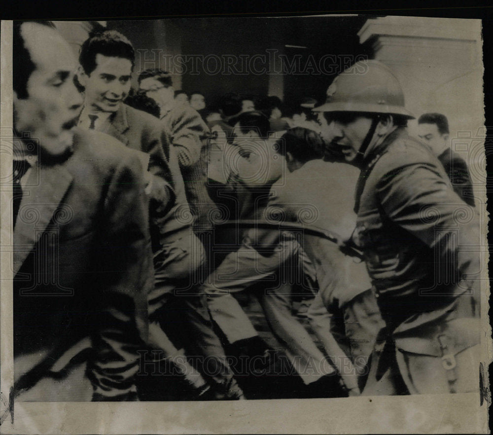 1962 Press Photo Peruvian Policeman Swings at Protestor - Historic Images