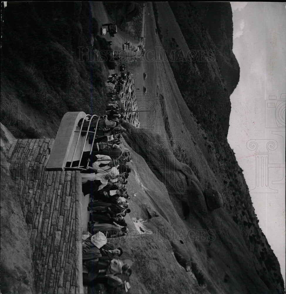 Press Photo A Couple Peers Over A Railing - Historic Images