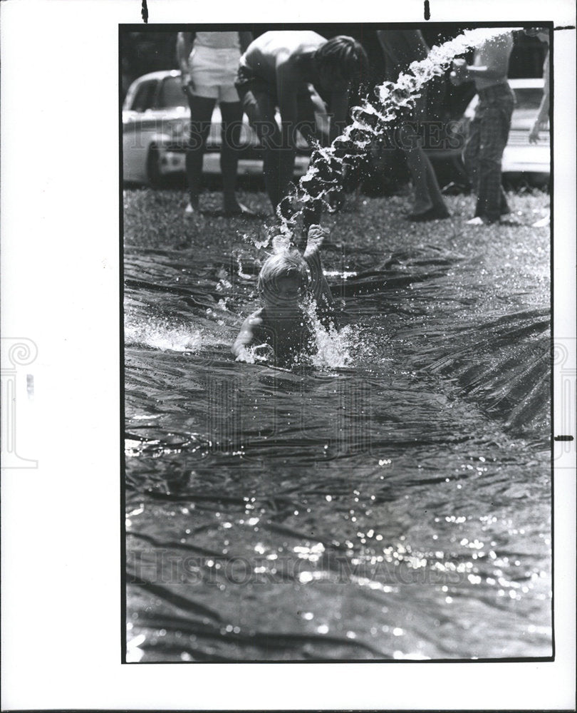 1977 Press Photo A Youngster  On The &quot;Slip N&#39; Slide&quot; - Historic Images