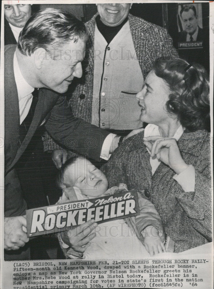 1964 Press Photo Tot Sleeps Through Rockefeller Rally. - Historic Images