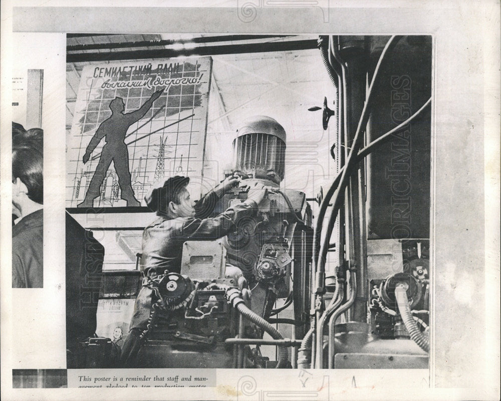 1961PressPhoto Poster in Moscow Factory to achieve goal - Historic Images