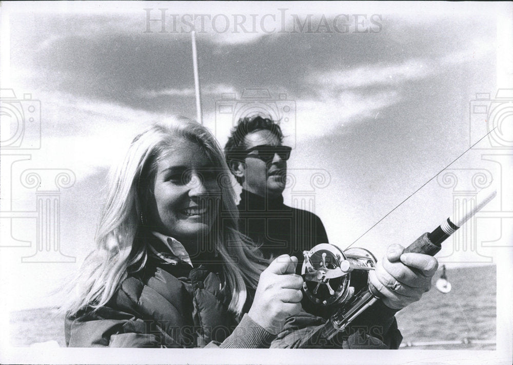 1969 Press Photo Boat Women Hold Fishing Stick Men - Historic Images