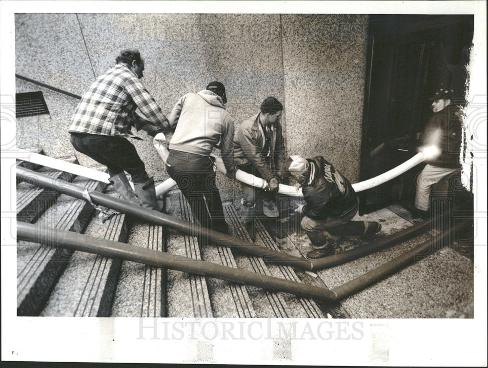 1992 Press Photo Chicago Workers Haul Drainage Hoses  - Historic Images