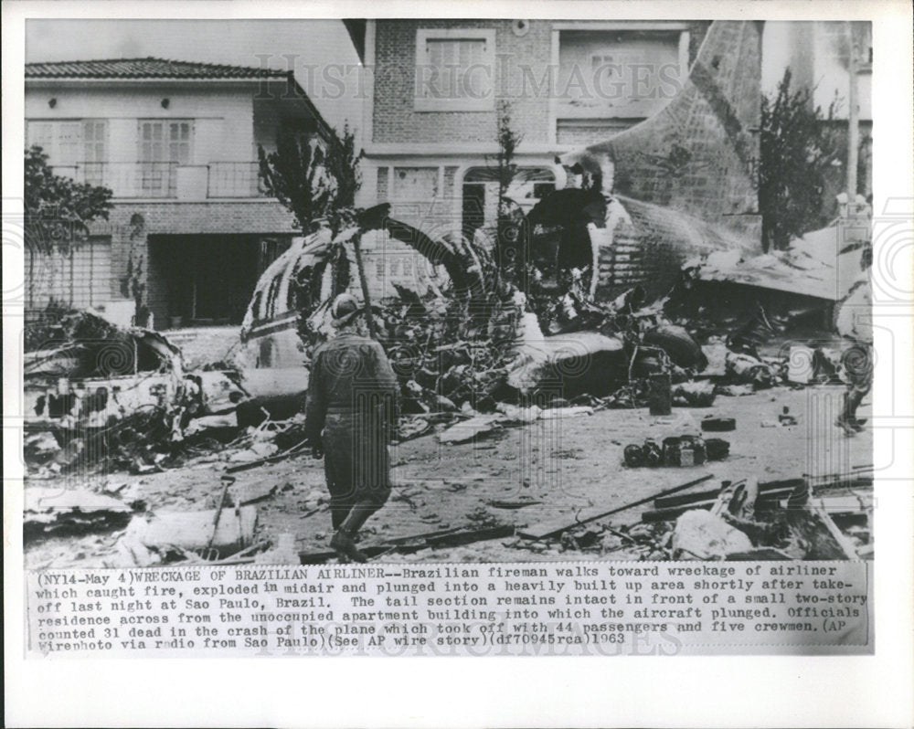 1963 Press Photo Brazilian fireman wreckage exploded  - Historic Images