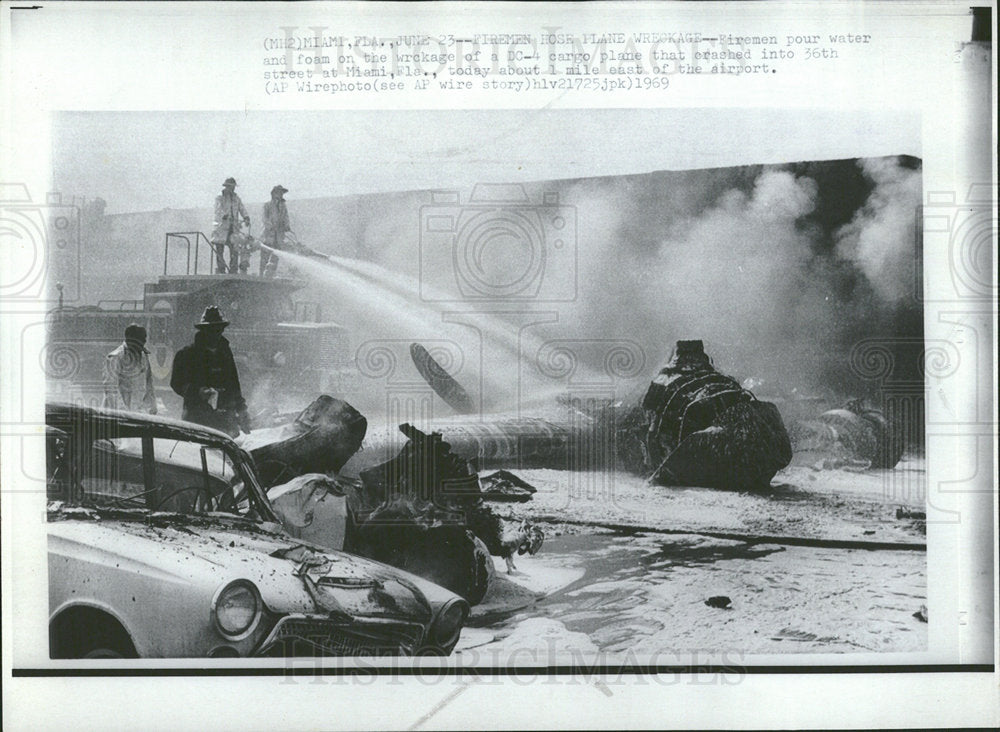 1969 Press Photo Fireman Water Foam Plane Crash Miami  - Historic Images