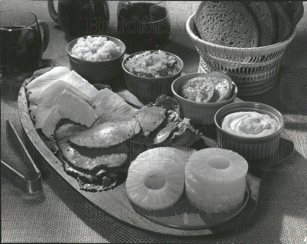 Food photo, pineapple, bread, condiments, deli meats - Historic Images