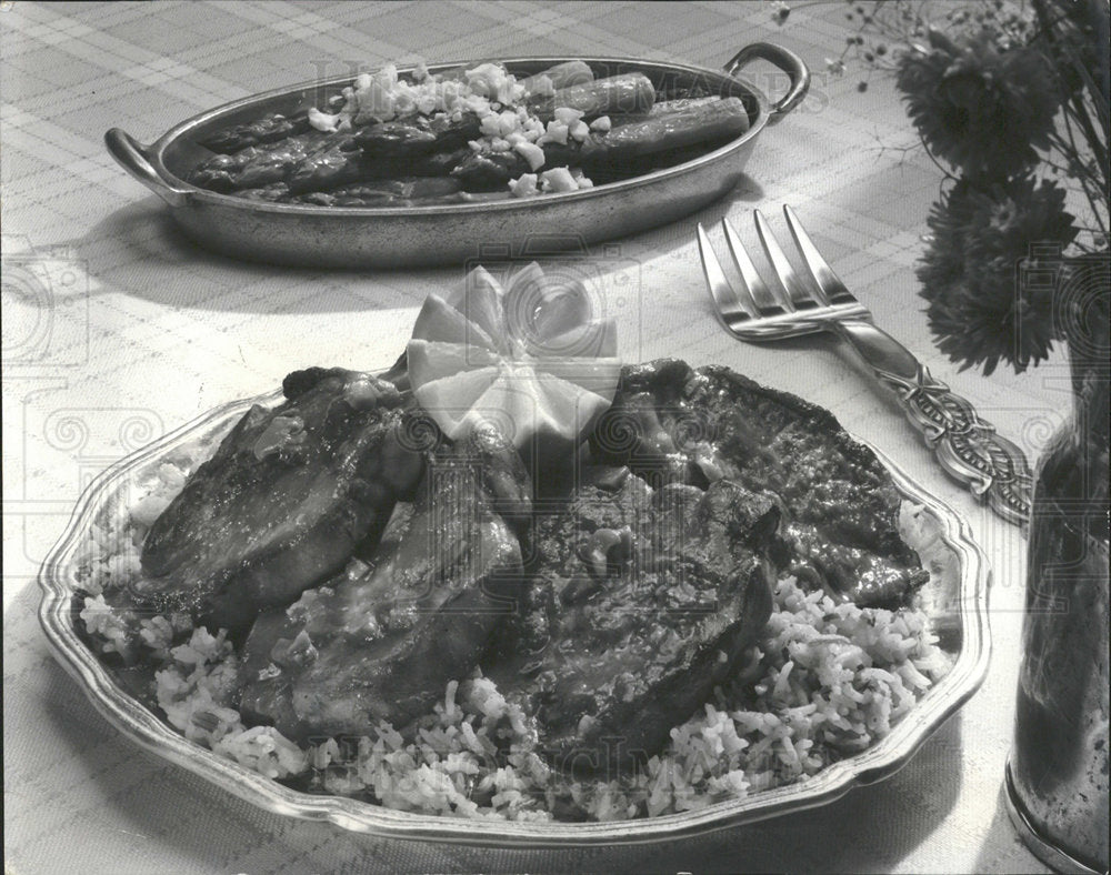 1979 Press Photo Pork Chops Sauce Wild Long Grain Rice  - Historic Images