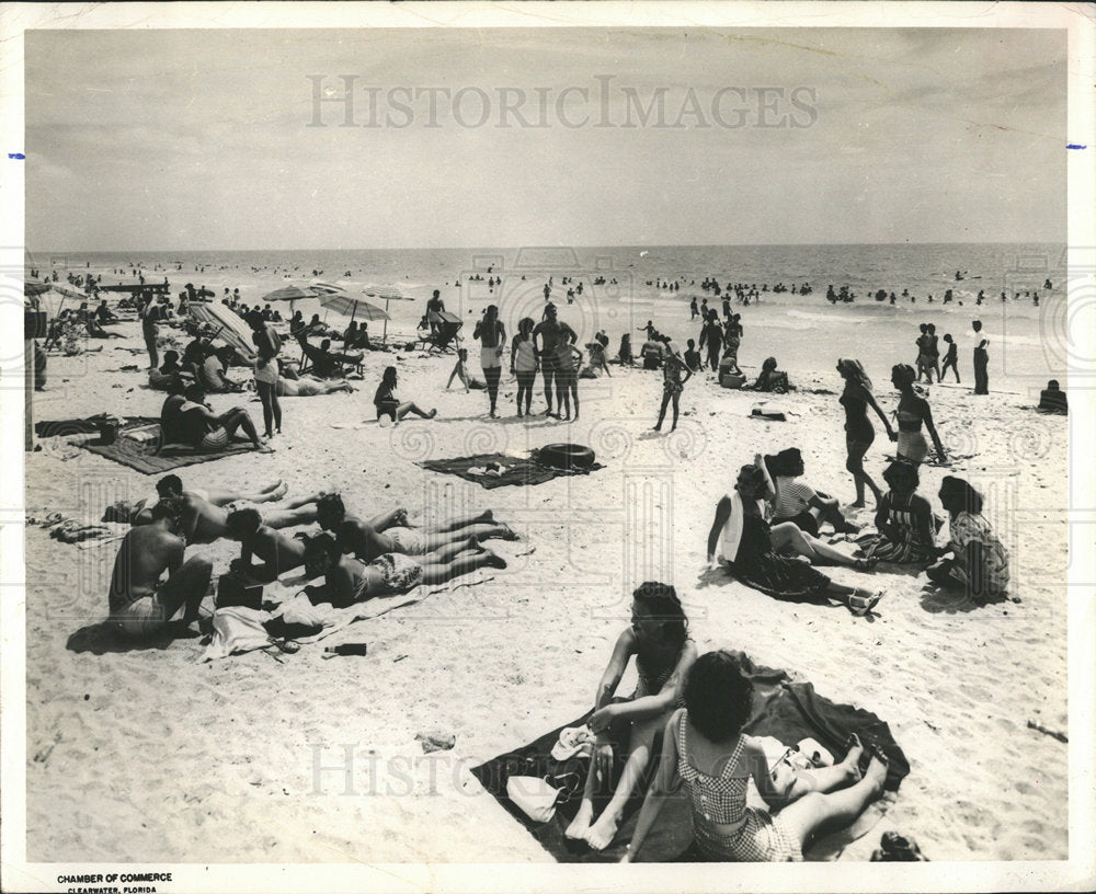 1957 Clear water beach winter month people - Historic Images