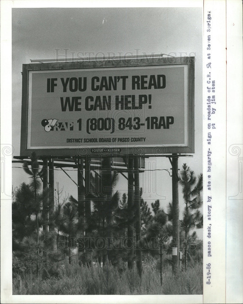 1986 Press Photo billboard If you can&#39;t read we help - Historic Images