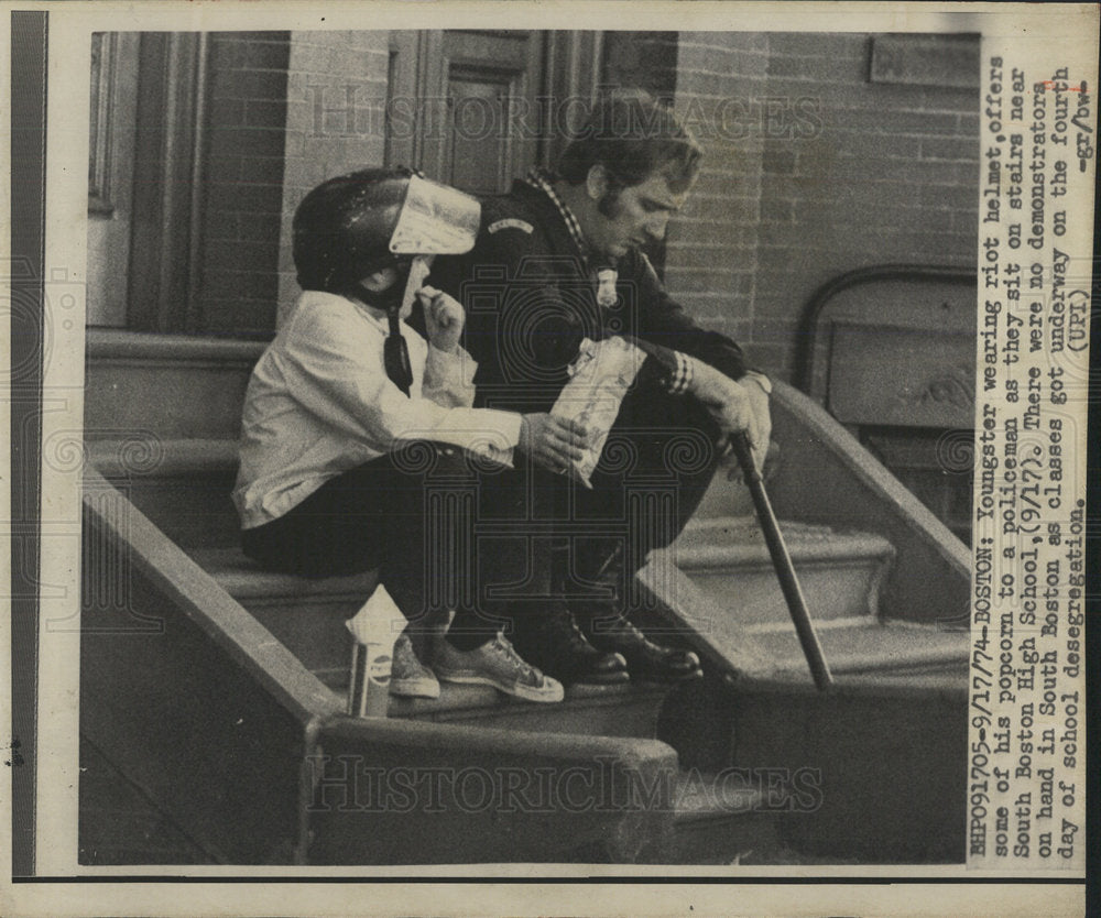 1974 Press Photo Youngster Riot helmet Boston High sit - Historic Images