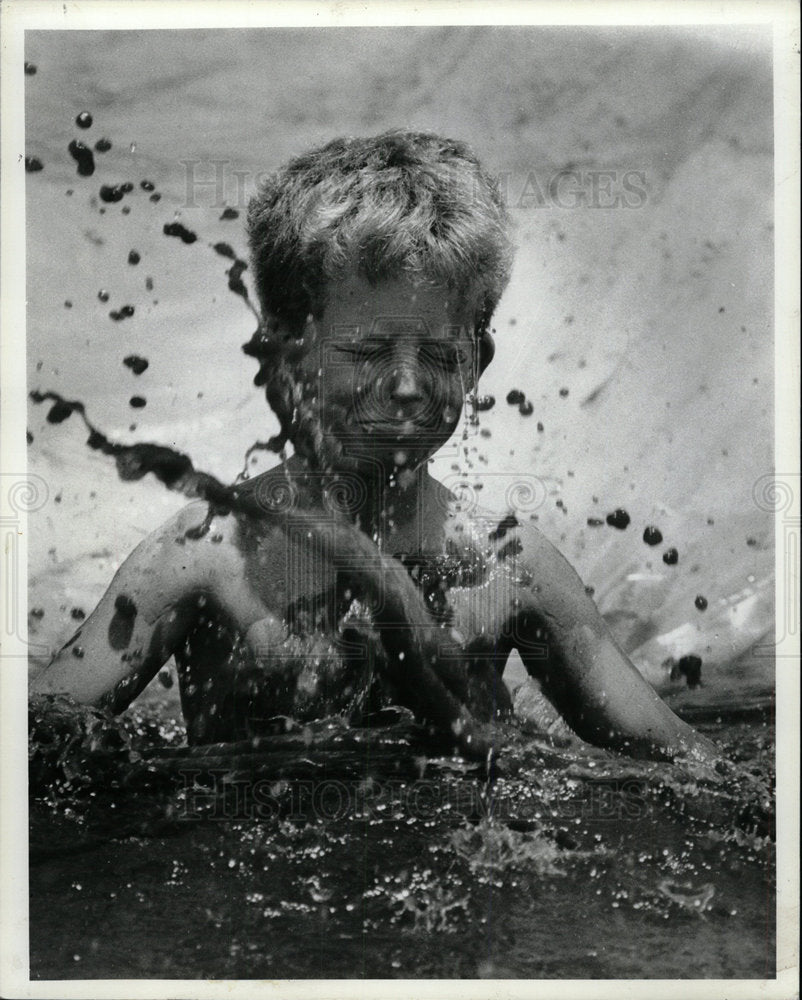 1979 Press Photo Dunedin Dirty Day Boy in Mud - Historic Images