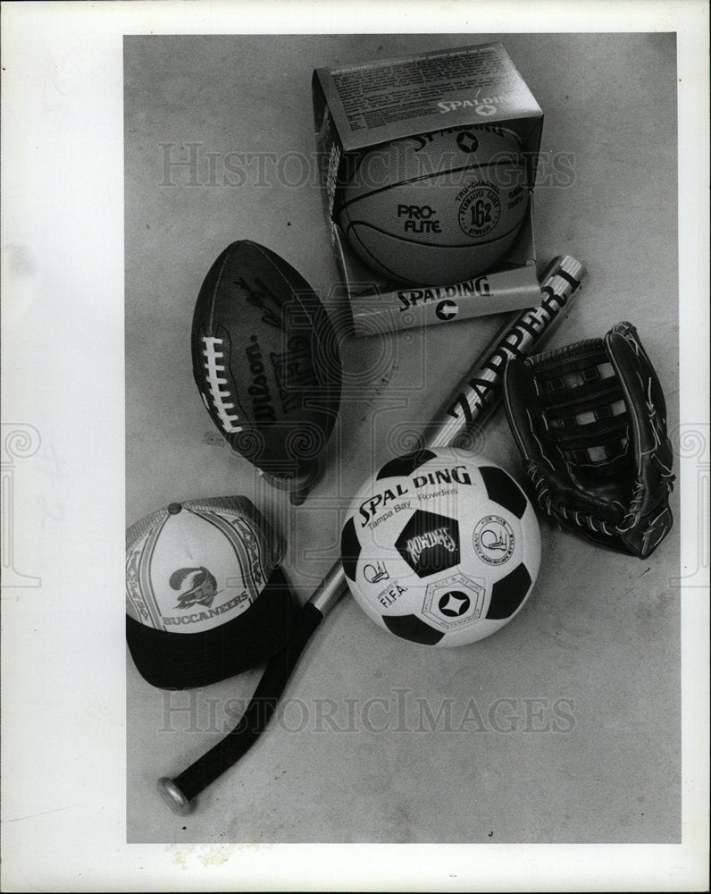 1982 Press Photo Bats Balls Football Hat Glove - Historic Images