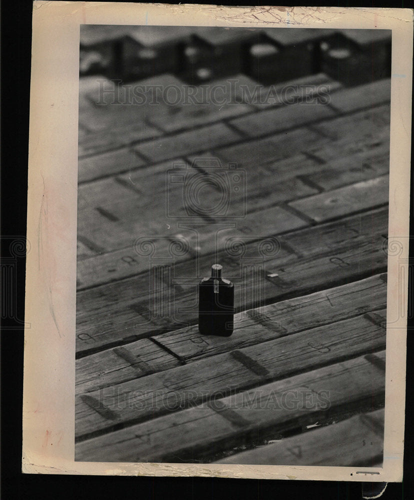 1964 Press Photo bottle sits ground - Historic Images