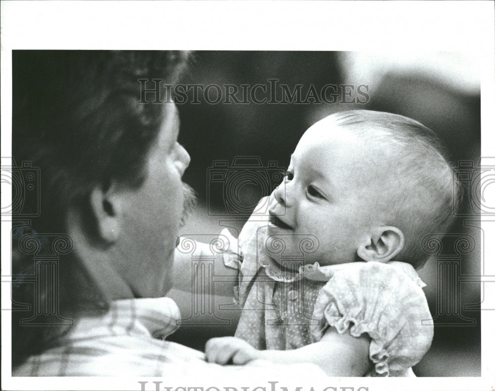 1991 Dan Hughes With His Infant Daughter, J - Historic Images