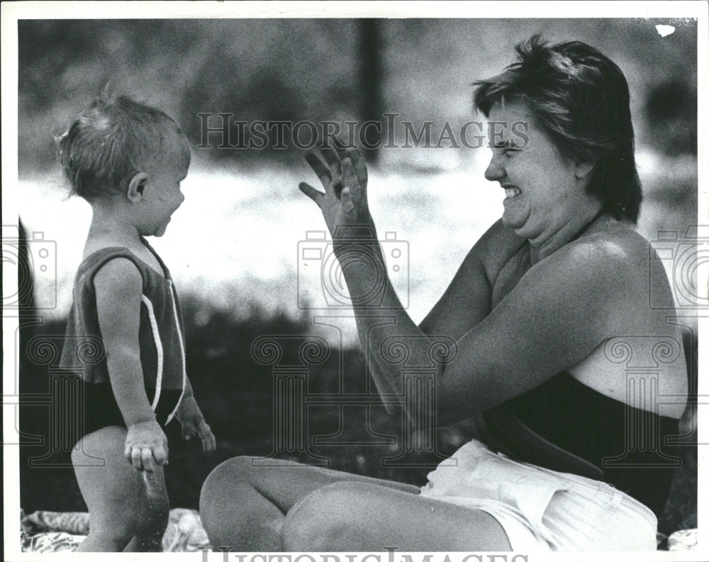 1984 Peek-A-Boo With Mom - Historic Images