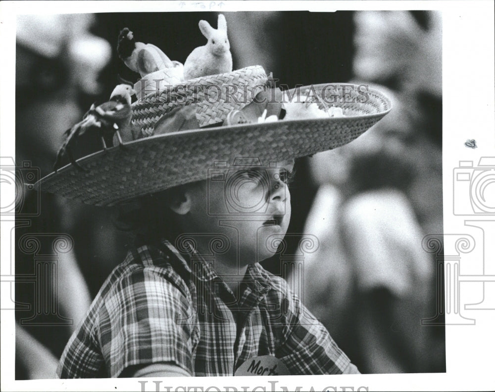 1986 of 1st Grader in Easter Bonnet and Par - Historic Images