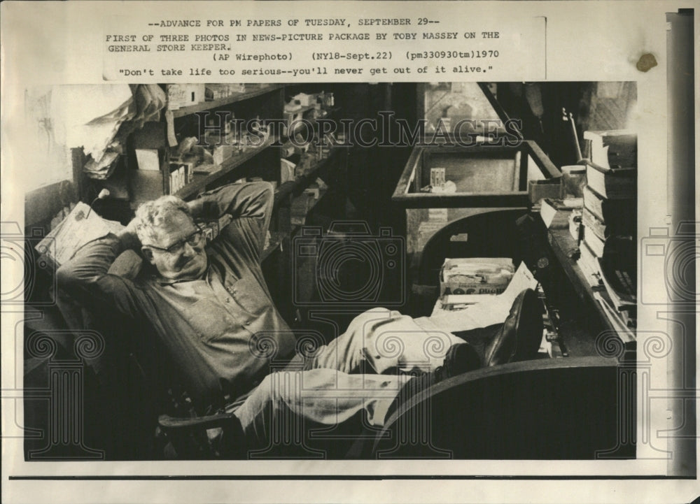 1970 General Store Keeper Putting His Feet - Historic Images