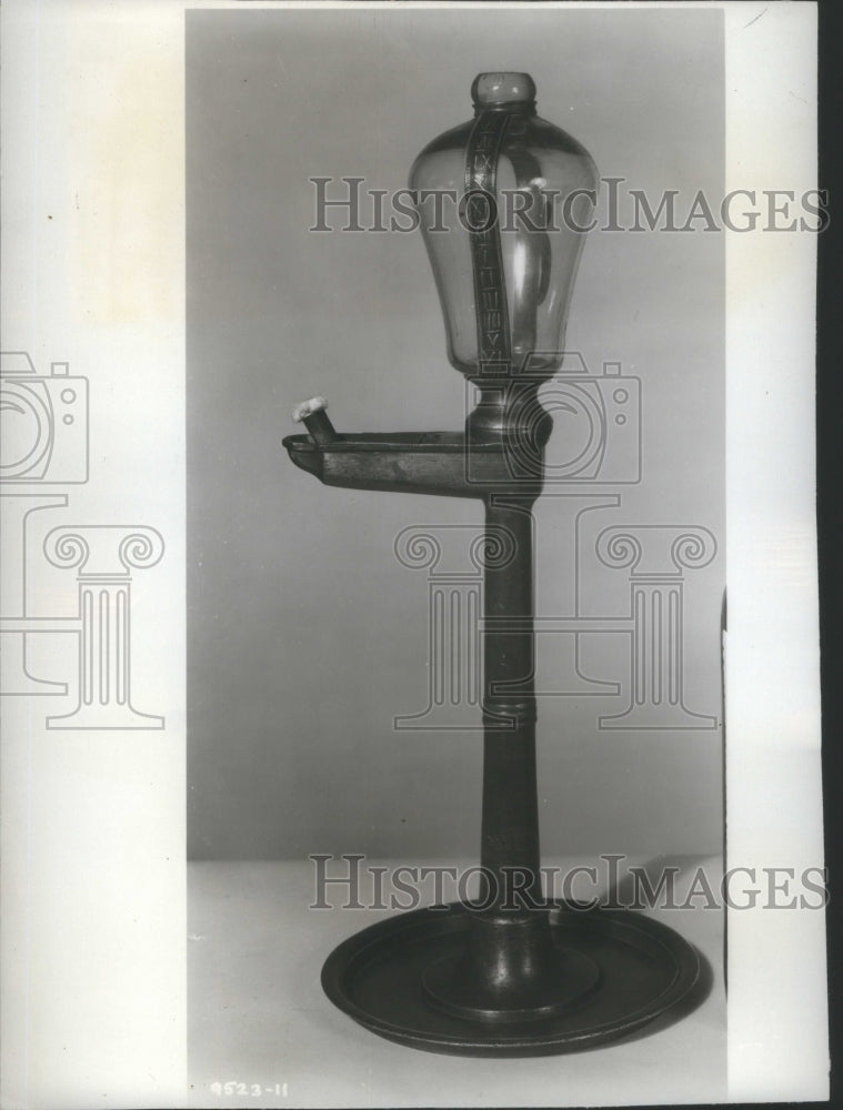 1955 Press Photo Glass globe metal band fire clock-Historic Images