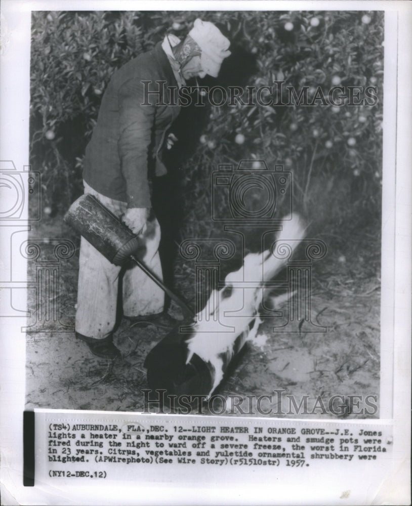 1957 Press Photo J.E Jones Lights Heater Nearby Orange- RSA16507 - Historic Images