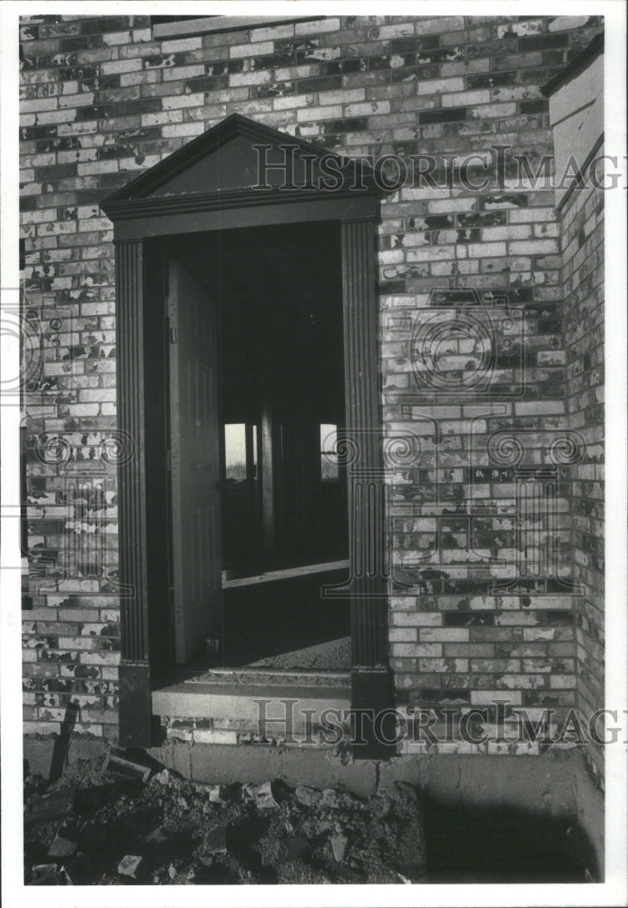 1980 Brick work on the town house is rated - Historic Images