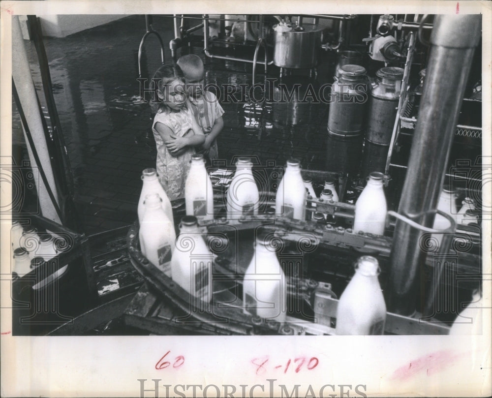 1963 Children Watch Milk Bottling Process - Historic Images