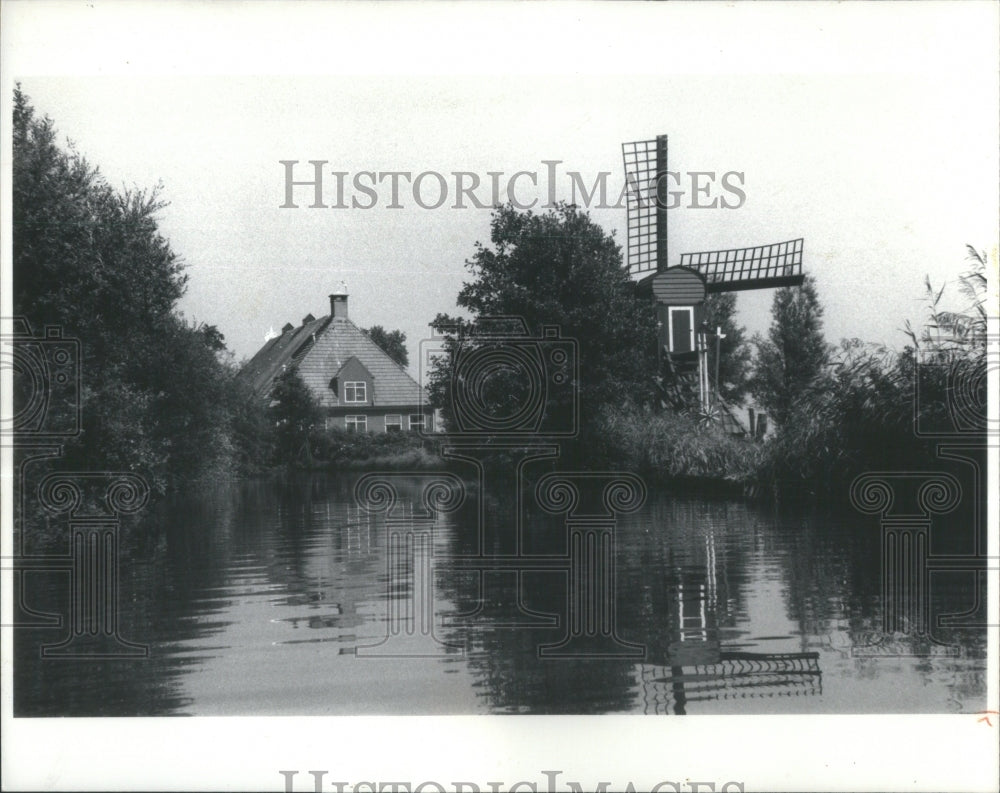 1978 Reflections shimmer windmill Holland - Historic Images