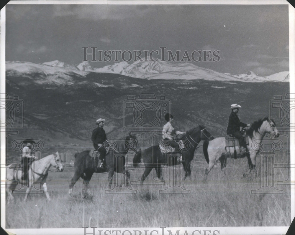 1968 Men climbing Mountain Horses Colorado - Historic Images