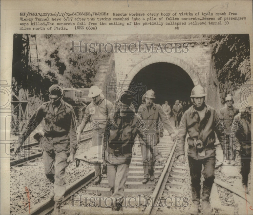 1972, rescue workers carry body victim train- RSA33875 - Historic Images