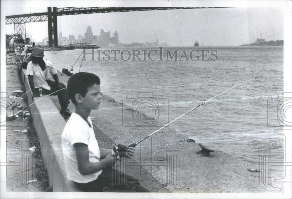 1972. A Young Boy Fishing The Detroit River - Historic Images