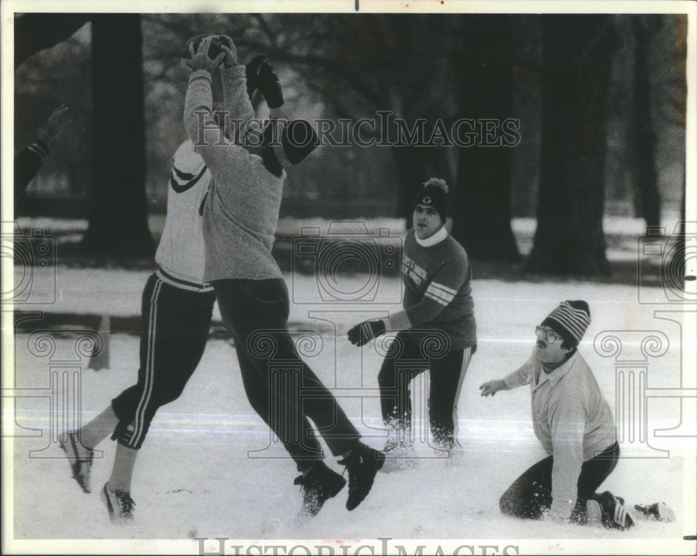 1984 SNOW BALL MAN LEAPS TOUCH FOOTBALL - Historic Images