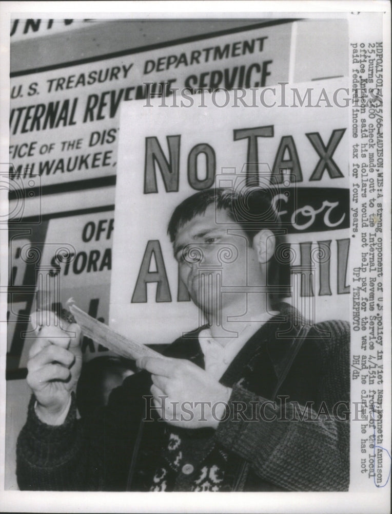 1966 Vietnam Protestor Burns Tax Check - Historic Images