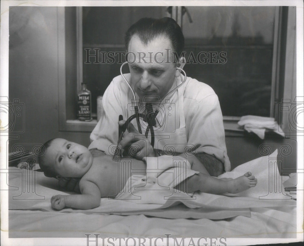 1954 Mary Jane Disandro examines Dr leader - Historic Images