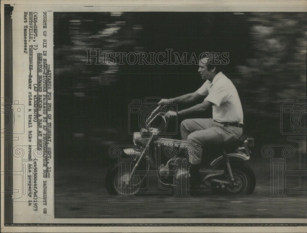 1973 Senator Howard Baker rides trail bike - Historic Images