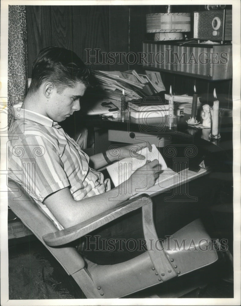 1966 Hartland Klotz studying Candle light storm - Historic Images