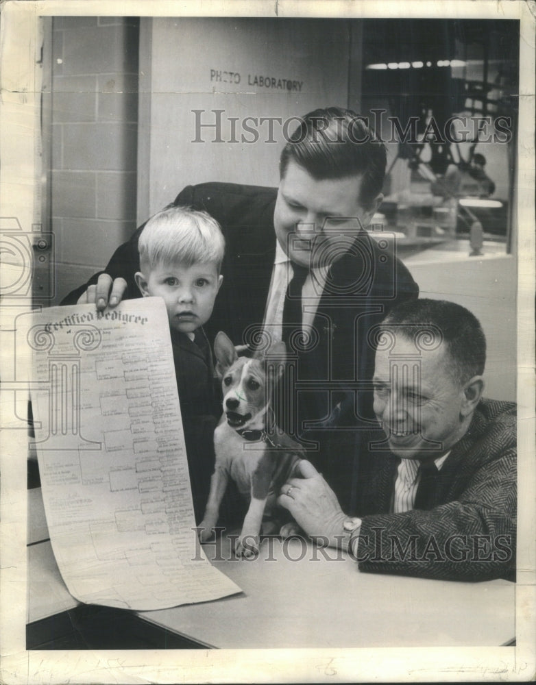 1964 Sun-Times' Jack Griffin with a Puppy. - Historic Images