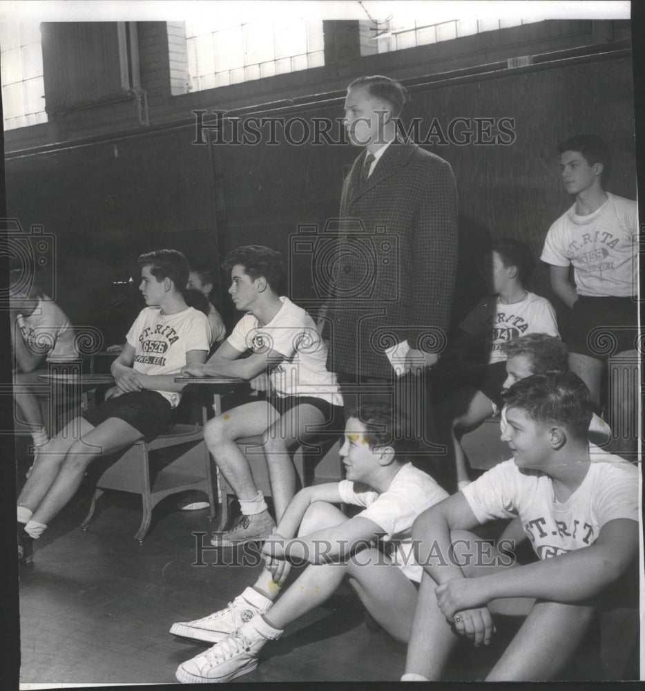 1960 Tomas Leonas watches a basketball game-Historic Images