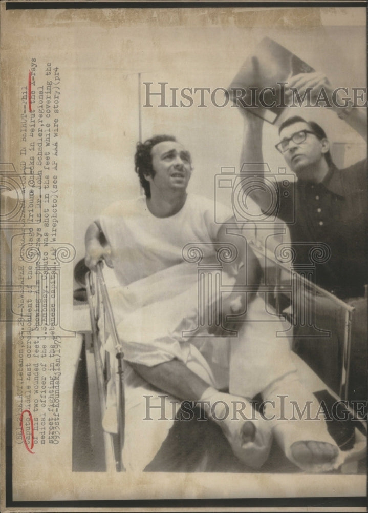 1975 Press Photo Phil Caputo shot in the feet. - Historic Images