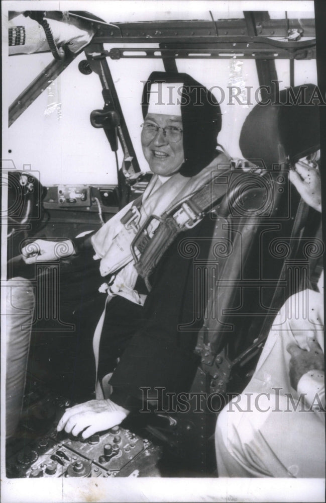 1959 Sister Mary Aquinas sits in cockpit of C-119 Flying Boxcar-Historic Images