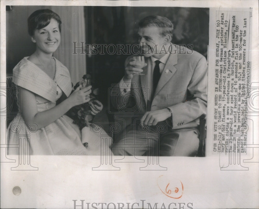 1960 Press Photo Christiane Blasche a German sprinter sips a drink during press - Historic Images