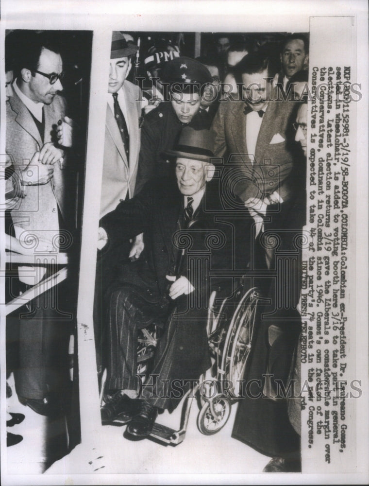 1958 Press Photo Laureano Gomes Colombian ExPresident wheel chair Voting Booth - Historic Images