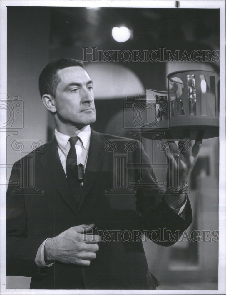 Press photo Dr. Albert Hibbs host &quot;Exploring&quot; holding a revolving platform. - Historic Images