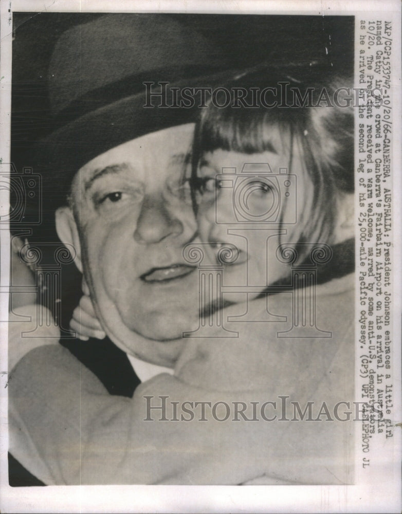 1966 President Lyndon Johnson embraced by a little girl named Cathy.-Historic Images