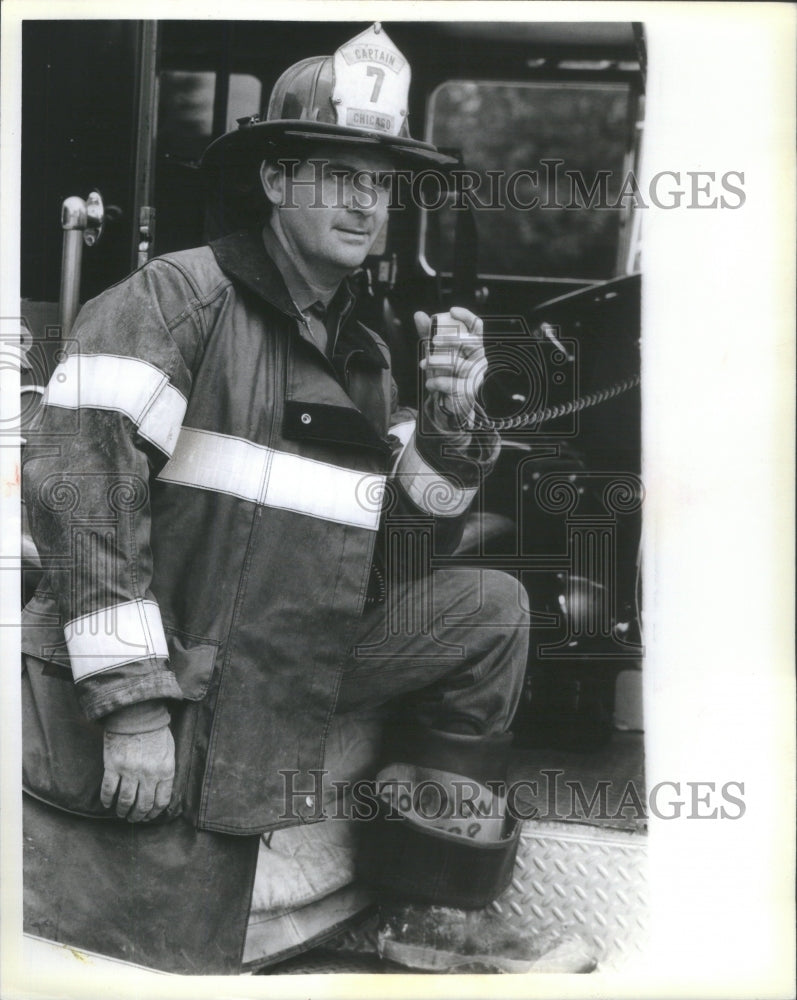 1985 Capt. Donald Gordon takes a call at Engine Company 26 - Historic Images