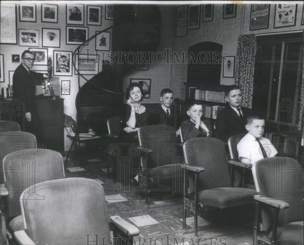 1963 Walter Kerr and his family sit in their studio/16-seat studio - Historic Images