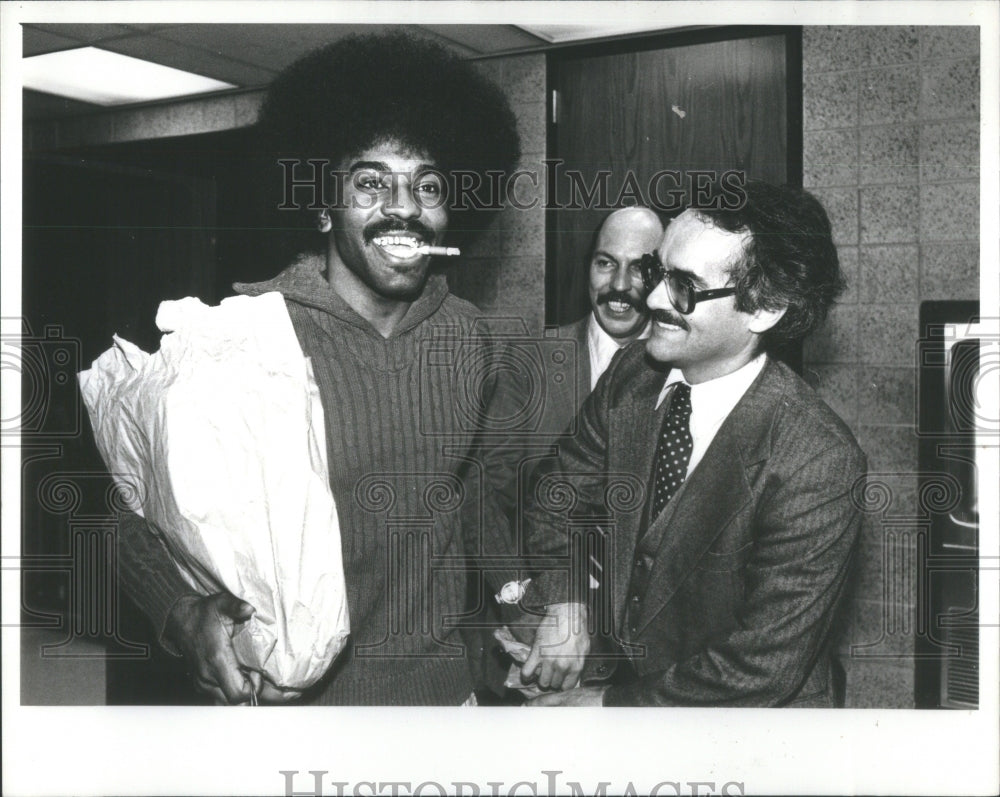 1980 Larry Hicks leaving Lake Co. Jail, with attorney Nile Stanton - Historic Images