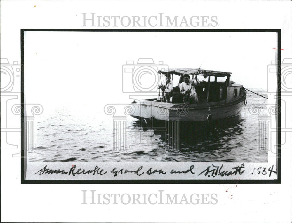 1983 Press Photo Two men fish in a cabin cruiser in the 1930s - Historic Images