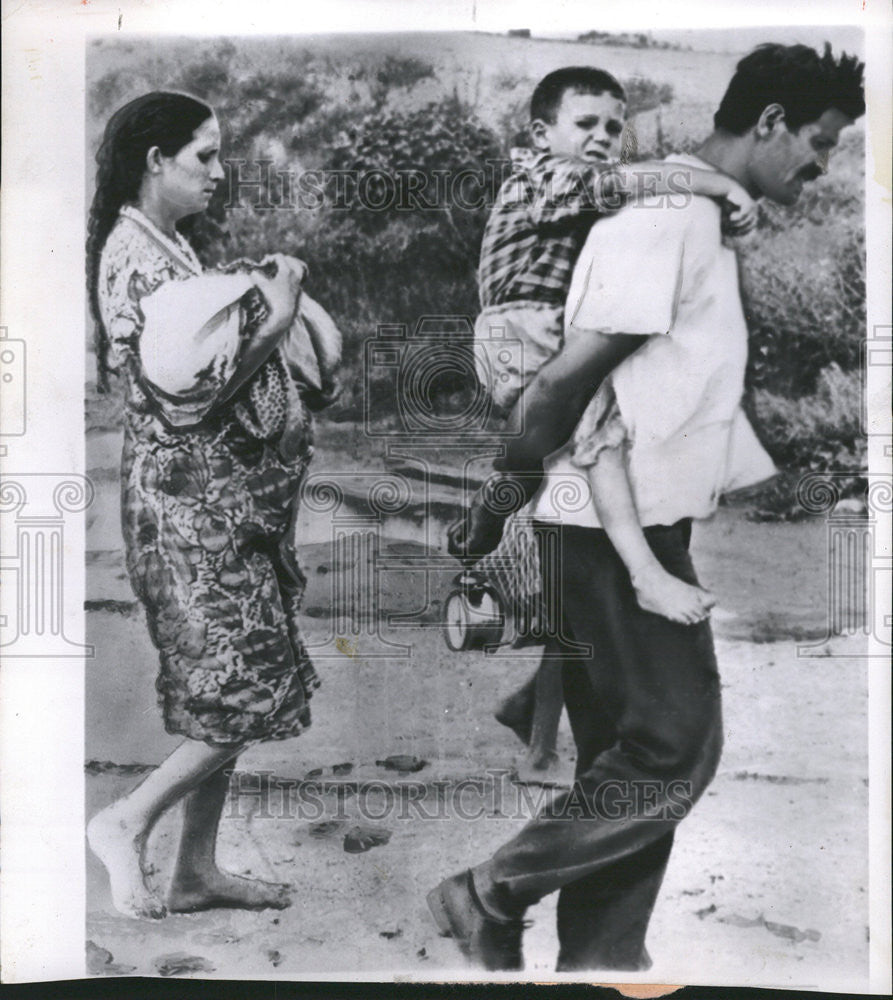 1963 Press Photo Man Carries Boy Piggy-Back After Yugoslavia Earthquake - Historic Images