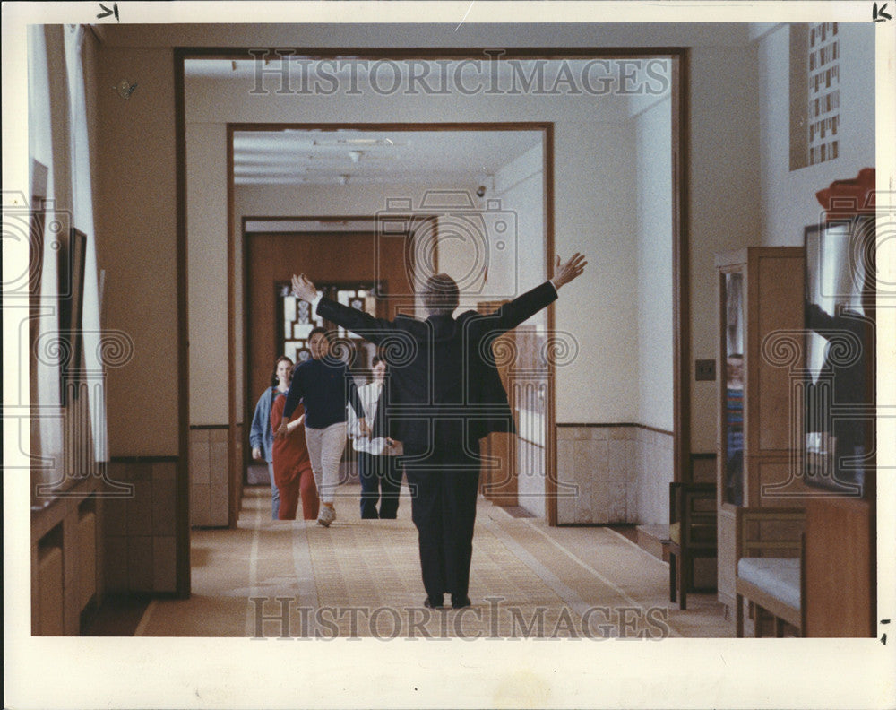 1993 Press Photo Head of Schools Dan Bearing rejoices in student&#39;s rescue. - Historic Images